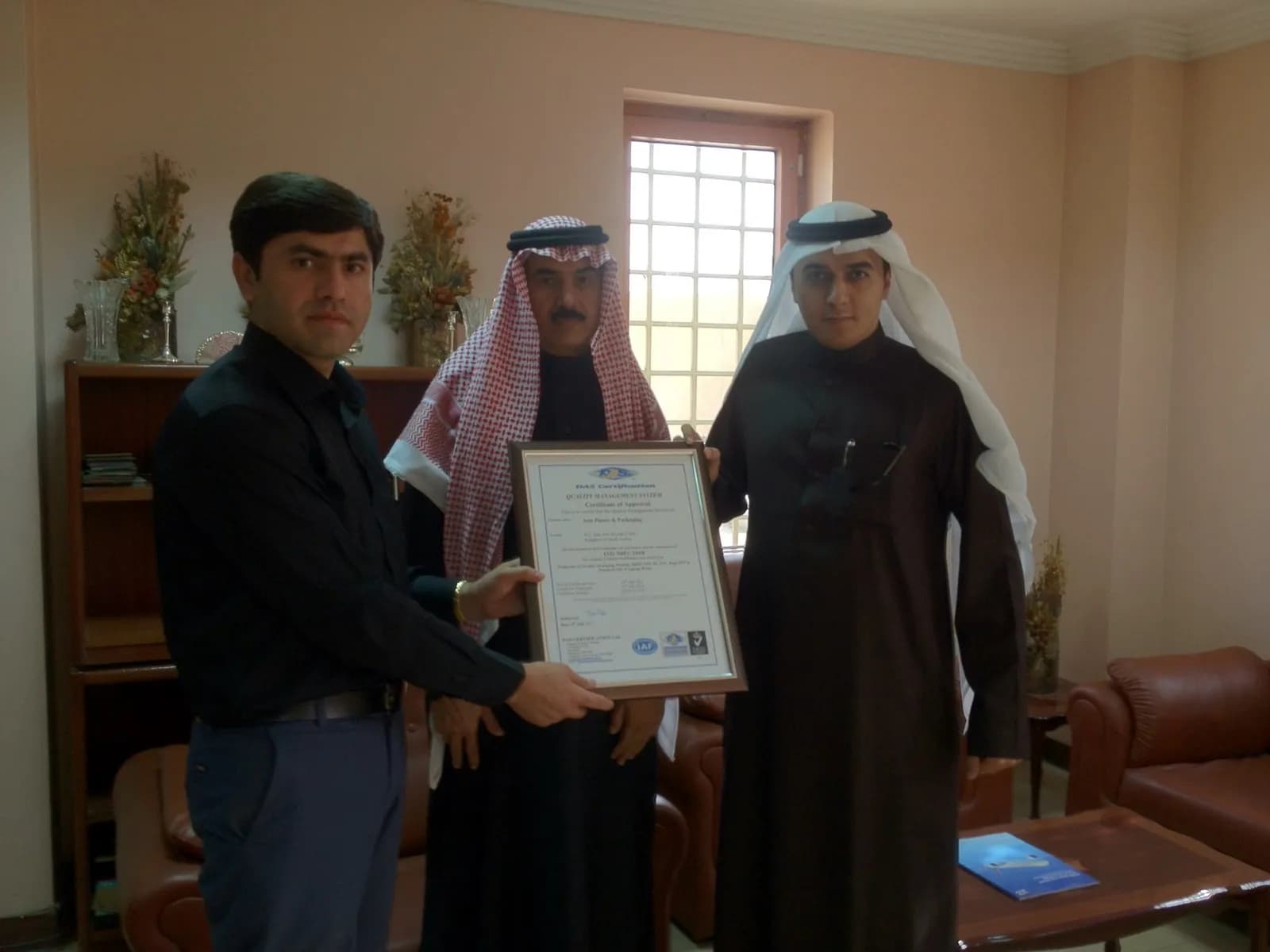 Asia Plastic & Packaging management receiving the ISO certificate
